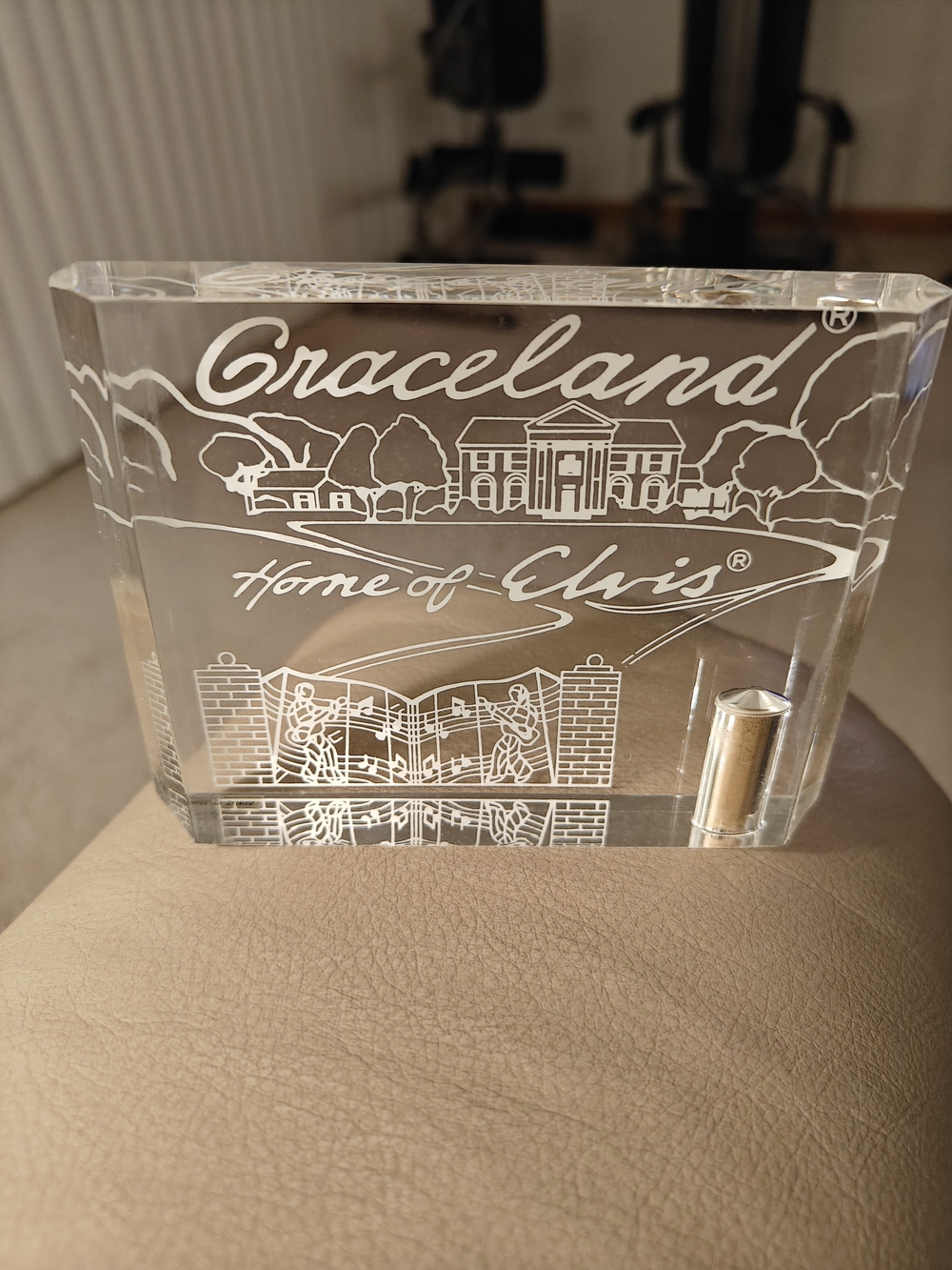 Elvis Presley lucite paperweight containing authentic soil from Graceland